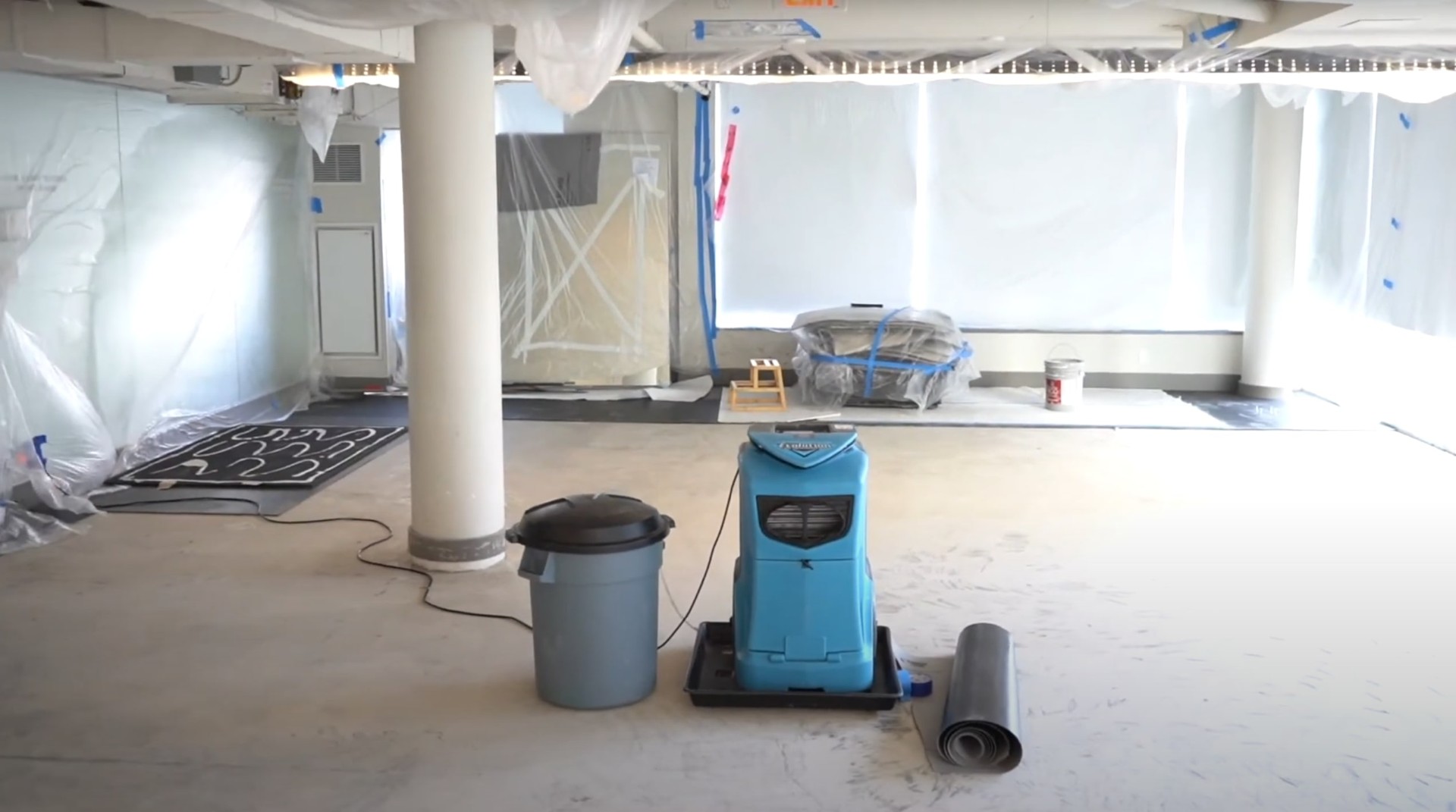 Professional restoration equipment for commercial and residential properties Water damage restoration equipment including dehumidifiers and air movers set up in Charleston office space